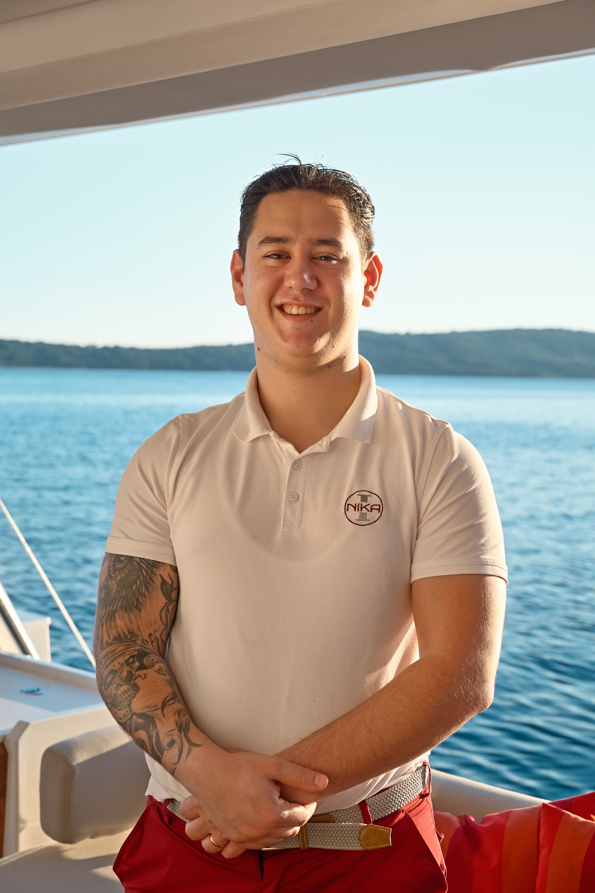 Chef smiling, NIKA I catamaran